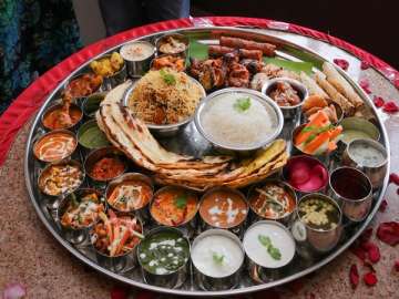 Treat your taste buds with a thali which offers more than 30 dishes