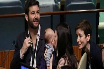 Ardern who brought her daughter Neve to the hall was seen cuddling and kissing her, with her partner Clarke Gayford sitting beside her. 