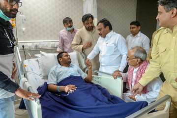 DMK leader A Raja meets Hardik Patel who has been on indefinite hunger strike for reservation since August 25.