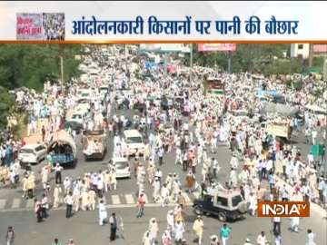 In Pics: Thousands of farmers march towards Delhi; police use water cannons, tear gas