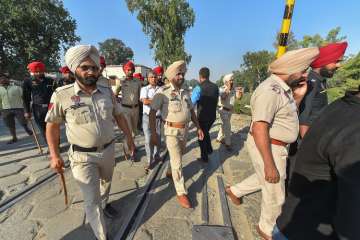 Policemen patrol at a railway crossing near the accident site in Amritsar.