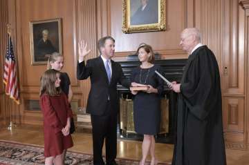 Wife Ashley Kavanaugh held the family Bible. Justice Kavanaugh's two daughters, Liza and Margaret, and his parents attended the ceremony.