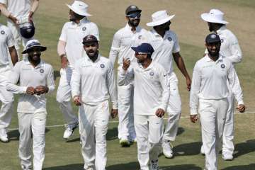 Indian players walk off the field after wrapping up the Rajkot Test within three days.