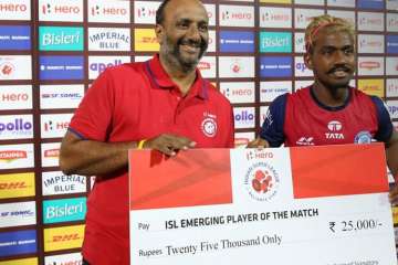 Jamshedpur FC player Gaurav Mukhi(left) receiving Emerging Player award after the match. 
