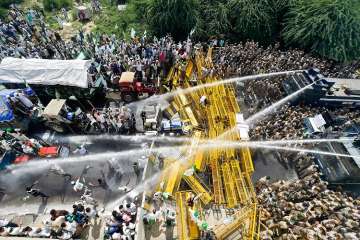 Police use water cannons to disperse farmers protesting at Delhi-UP border during 'Kisan Kranti Padyatra' in New Delhi. (PTI Photo)