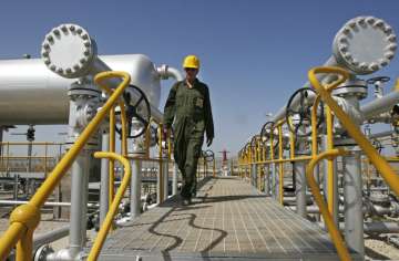 An oil technician in an oil field southwest of Tehran