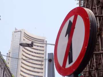 Sensex sheds 344 points on global meltdown, Rupee reaches 73.38 against USD