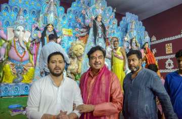 Patna: BJP MP Shatrughan Sinha with RJD leader Tejashwi Yadav attends 'Maha Ashtami' puja at a Durga