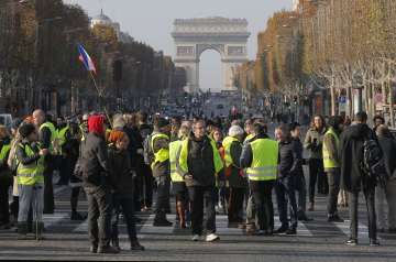  
Police officers lobbed tear gas canisters at demonstrators on the famed Champs-Elysees Avenue in Paris as groups of “yellow jackets,” as the protesters called themselves, tried to make their way to the presidential Elysee Palace.