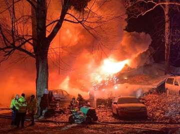 The building’s roof collapsed after fire gutted most of the interior of the two-story, wood-frame house.