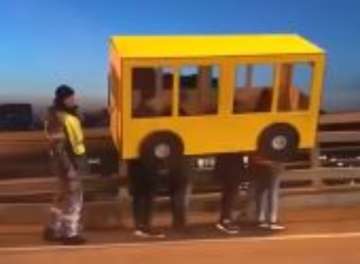Russian men try to cross No Pedestrian Bridge pretending to be ‘Human-Bus’