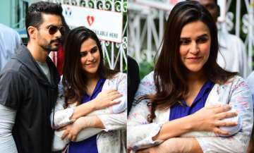neha dhupia comes home with daughter mehr