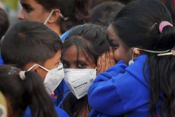 File photo of Delhi school students wearing mask
