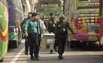 Bangladeshi security personnel carry voting material