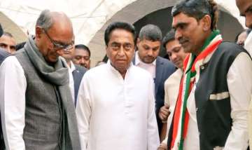 CM Kamal Nath helps Congress worker, who pledged to remain barefoot till party comes to power, wear 