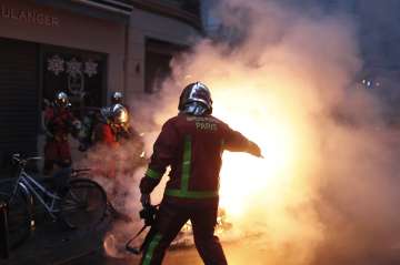  
Protesters, chanting the slogans of 'Macron resign' clashed with police who resorted to tear gas to contain them.