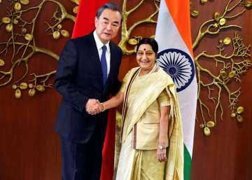 Union External Affairs minister Sushma Swaraj shakes hands with her Chinese counterpart Wang Yi in New Delhi