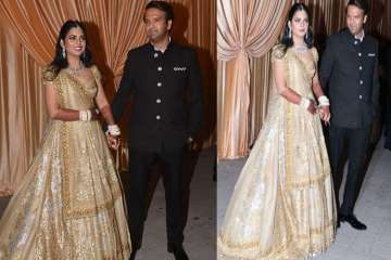 New Pics Alert! Isha Ambani, Anand Piramal are perfect blend of gold and black at their Wedding Reception
 