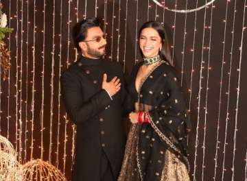 Ranveer Singh burns the dance floor as loving wife Deepika Padukone fixes his outfit