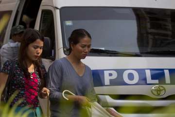 Pan Ei Mon, right, wife of Reuters journalist Wa Lone, walks together with Chit Su Win, left, wife of Reuters journalist Kyaw Soe Oo, as they leave the High Court in Yangon, Myanmar