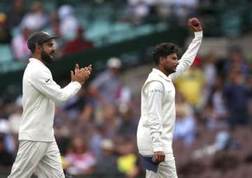 Kuldeep walks off after claiming his 2nd five-for in Tests.