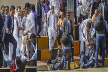 Congress President Rahul Gandhi offering help to a photographer who fell down while covering his arrival at Biju Patnaik International Airport in Bhubaneswar