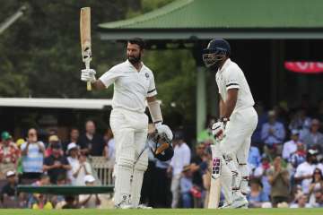 India vs Australia 4th Test Match: Pujara raises his bat after scoring his 18th Test century.