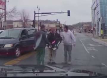 Baby slips out of a moving car while still strapped to the car seat