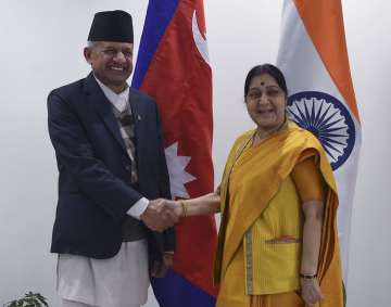 External Affairs Minister Sushma Swaraj greets her Nepali counterpart Pradeep Kumar Gyawali, in New Delhi