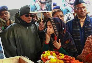 Dehradun: Nitika Kaul, wife of Major Vibhuti Shankar Dhoundiyal, who lost his life in Pulwama encounter with Jaish-e-Mohammed (JeM) terrorists, gestures while paying her last respects to him ahead of his funeral