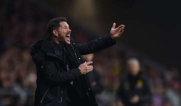 UEFA charges Atletico coach Simeone for obscene gesture