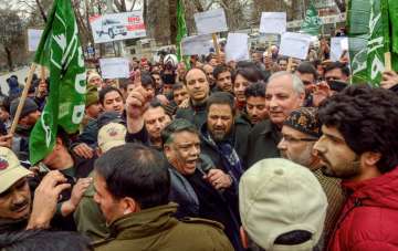 Members of People's Democratic Party (PDP) raise slogans in protest against the harassments of Kashm