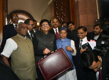 Finance Minister Piyush Goyal with MoS Finance ministers Shiv Pratap Shukla and P Radhakrishnan  in the Parliament to present the interim Budget 2019-20