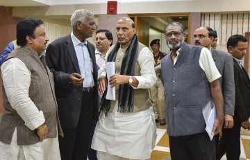 Union Home Minister Rajnath Singh and CPI leader D Raja after attending an all-party meeting on the Pulwama terror attack, at Parliament Library building, in New Delhi