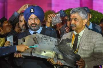 Indian Air Force officials show sections of an exploded Amraam missile, said to be fired by Pakistan Air Force (PAF) F-16s