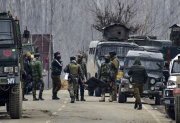 Security forces personnel arrive for the reinforcement during a gunbattle with the militants in whic