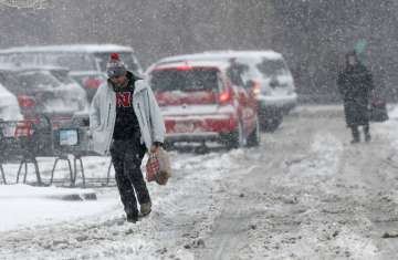 ‘Epic’ storm brings blizzards, floods, tornado to mid-US