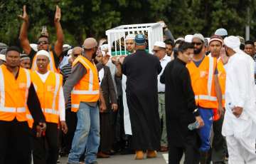 Mourners carry the body of Imam Hafiz Musa Patel, a victim of the Mosque attack in New Zealand