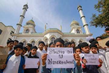  Jammu: Children hold placards to condemn the New Zealand mosque attack