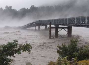 Bridge over Waiho river in New Zealand gets washed away due to heavy storm