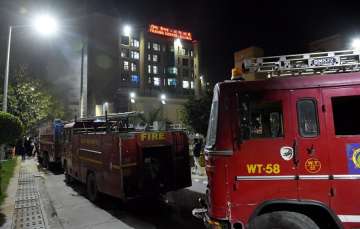 Fire fighters at AIIMS Trauma Centre after a fire in New Delhi