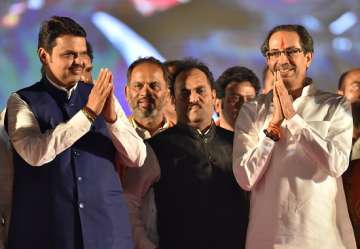 Maharashtra Chief Minister Devendra Fadnavis and Shiv Sena Chief Uddhav Thackeray during a rally in Kolhapur
