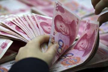 Chinese yuan edges higher against US dollar