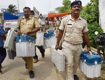 Bhagalpur: Security officials collect Electronic Voting Machines (EVM) and other election material f