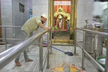 A Muslim man cleans and takes care of a Ram temple in Bengaluru