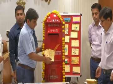 DC Vikrant Pandey sending out postcards through India Post in Ahmedabad
?