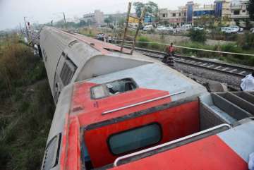 The derailed Howrah-New Delhi Poorva Express near Rooma railway station, about 20 km from Kanpur