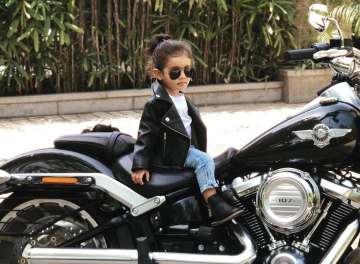 Asin’s 18 month old daughter Arin is the perfect ‘Baby biker’ and this picture is proof