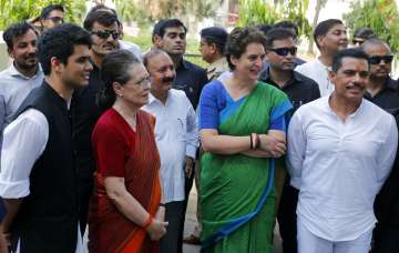 ?Congress party leader Sonia Gandhi, second left, stands with her daughter and party General Secretary Priyanka Vadra, her son-in-law Robert Vadra and grandson Raihan Vadra after filing her nomination papers for the upcoming general elections in Rae Bareli.