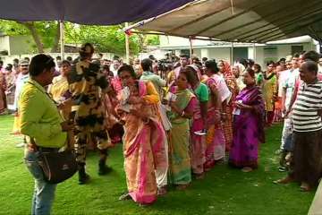 People of West Bengal standing at a polling booth